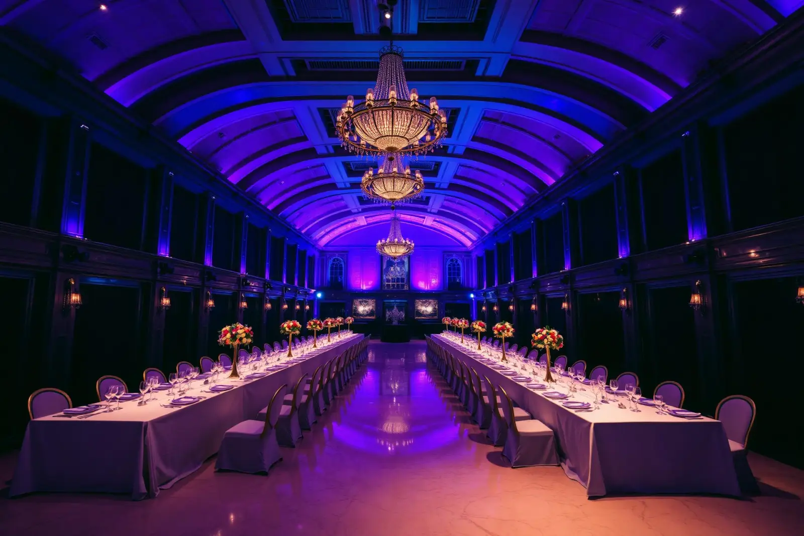 Grand ballroom venue lit in violet